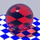 Red glass sphere, which colors the caustics cast on the table red