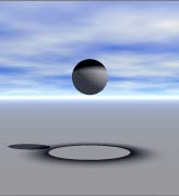 A sphere in broad daylight, with a black anti-light on the top, and a black pool of anti-light below it, with the anti shadow of the sphere showing bright in the middle. It looks like someone dropped black paint on the sphere from above.