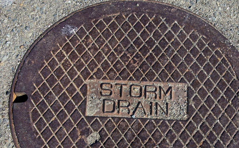 A manhole cover labeled Storm Drain